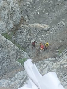Men fall in dawn in deep gorge during take selfy 